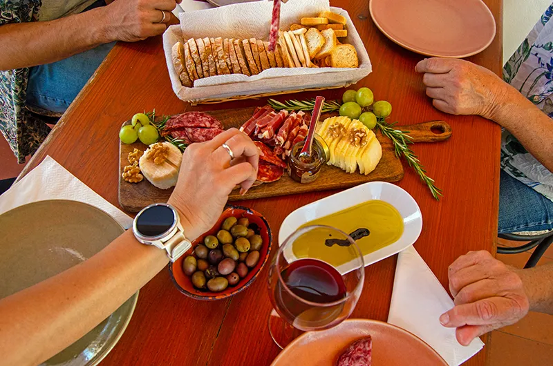 people tasting food and wine in algarve moments tour